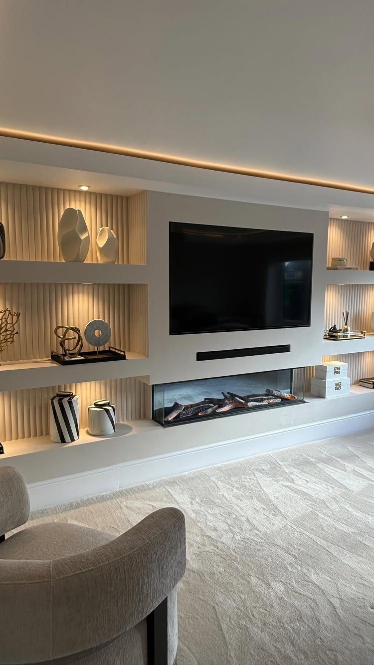 Light grey textured carpet covers the floor of a modern living room with a fireplace.