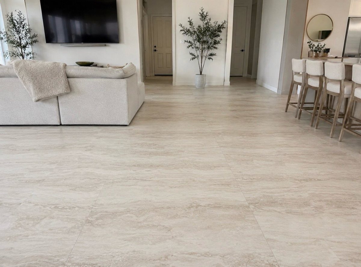 Light beige porcelain tiles with a stone texture in a modern living room setting.