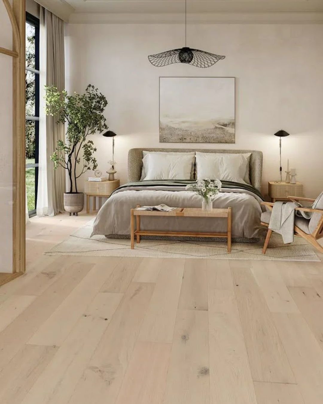 Light wood plank flooring in a bright, modern bedroom with a neutral-toned bed and minimalist decor.