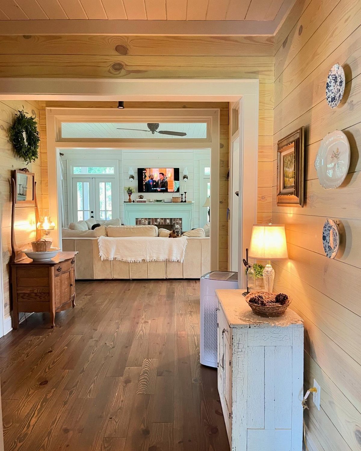 9 Natural Wood Shiplap Wall Ideas for Every Room 3 Light-toned natural wood shiplap walls and ceiling in a bright, modern home hallway.