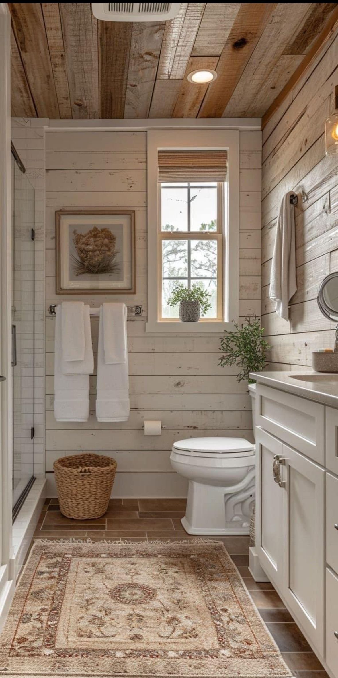 9 Natural Wood Shiplap Wall Ideas for Every Room 5 White shiplap walls and natural wood ceiling in a cozy, rustic bathroom setting.