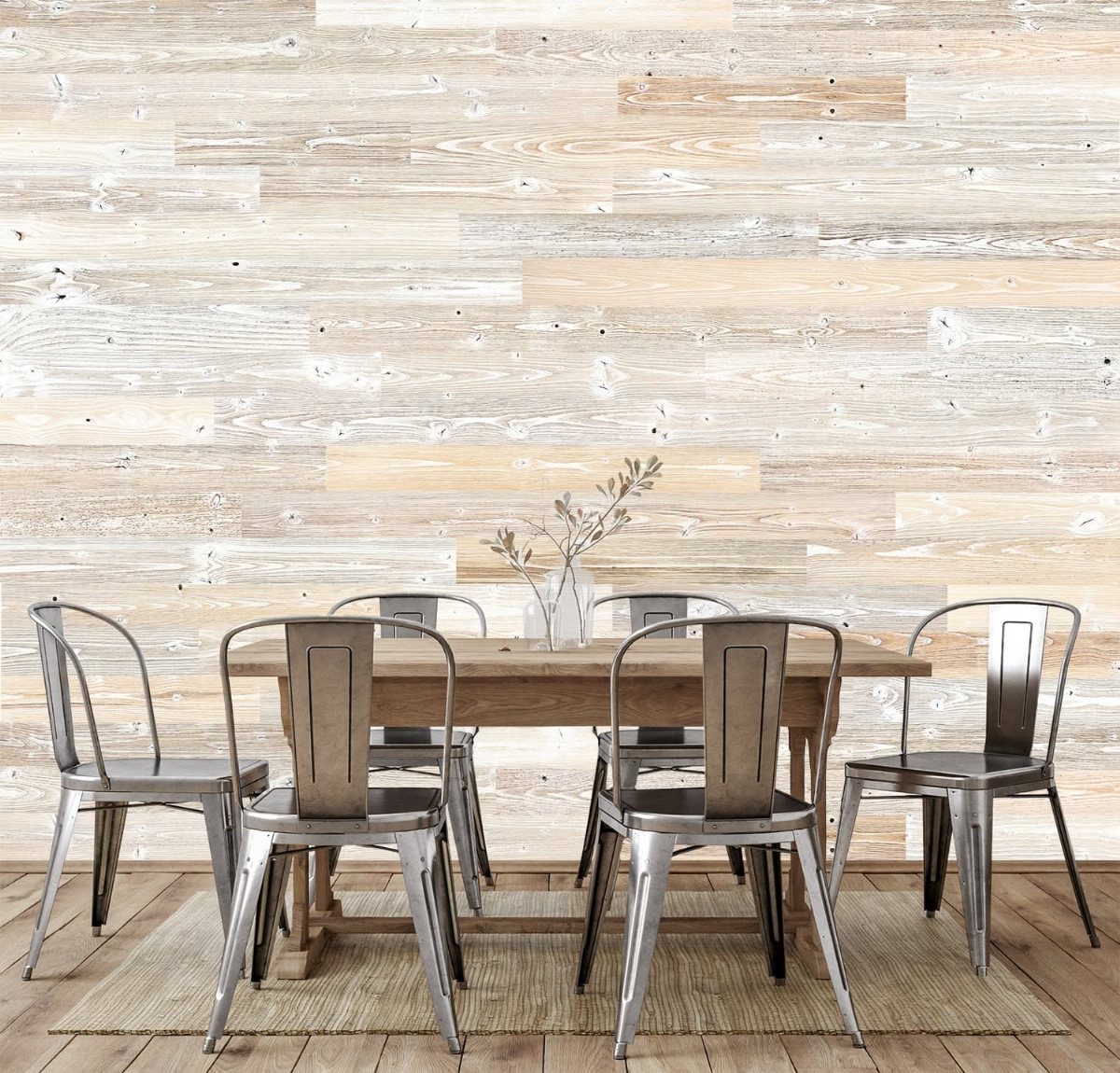 Whitewashed pine shiplap planks covering a wall behind a wooden dining table and metal chairs.