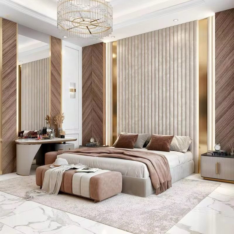 Modern bedroom with chevron patterned wood wall panels and a large fluted headboard.